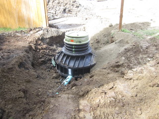 Sewer grinder pump tank installation excavation